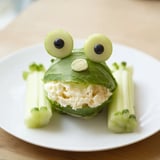 Delightful Frog Pond Snack Tray: Creative presentation of cucumber lily pads and colorful berries.