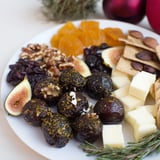 This Squirrels Acorn Hoard Platter shows a rustic autumn snack board with nuts, cheese, and dried fruit.