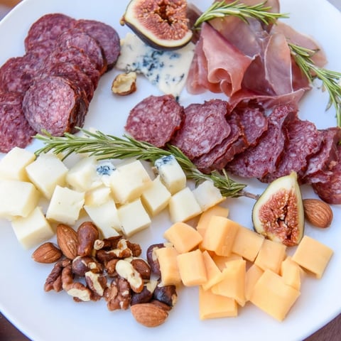 Elegant Deer Antler Charcuterie board display, featuring game meats, cheeses, and garnishes beautifully arranged.